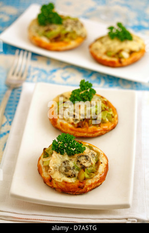 Tartlets with leek and blue cheese. Recipe available. Stock Photo