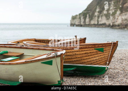 Wooden rowing boats on Beer beach, Dorset, England, UK Stock Photo