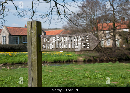Close up of wooden signpost sign pointing to path bridleways and footpaths footpath Sinnington North Yorkshire England UK United Kingdom Great Britain Stock Photo