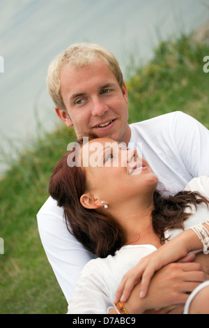 Image of young couple relaxing outdoors Stock Photo