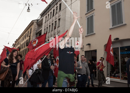 Milan, Italy - May 1, 2013: People march in the streets for the traditional May Day parade Stock Photo