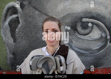 Sheffield, UK. 2nd May 2013: Sheffield Graffiti artist, Sarah Yates at the unveiling of her 42ft mural on the side of Sheffield's Howard Hotel.  The mural depicts Sheffield's Harry Brearley who discovered stainless steel in the City 100 years ago.  Sarah, also known as Faunagraphic, is one of just a few professional British graffiti artists. Sarah, 26, says: 'He looks like he's determined. [He's got a] I'm going to improve the world type look. I'm going to create something that people will remember.' Credit:  Matthew Taylor / Alamy Live News Stock Photo