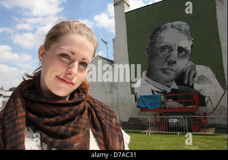 2 May 2013: Sheffield Graffiti artist, Sarah Yates at the unveiling of her 42ft mural on the side of Sheffield's Howard Hotel.  The mural depicts Sheffield's Harry Brearley who discovered stainless steel in the City 100 years ago.  Sarah, also known as Faunagraphic, is one of just a few professional British graffiti artists. Sarah, 26, says: 'He looks like he's determined. [He's got a] I'm going to improve the world type look. I'm going to create something that people will remember.' Stock Photo