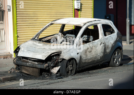 stolen abandoned car burnt out riot rioting Stock Photo