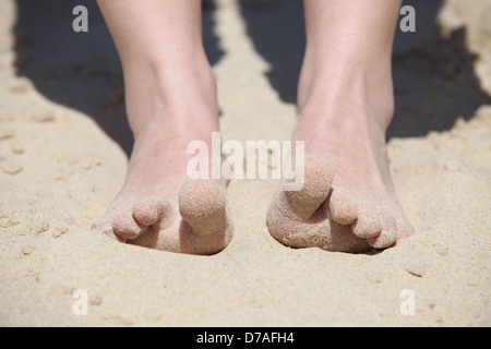 Feet digging into the sand Stock Photo