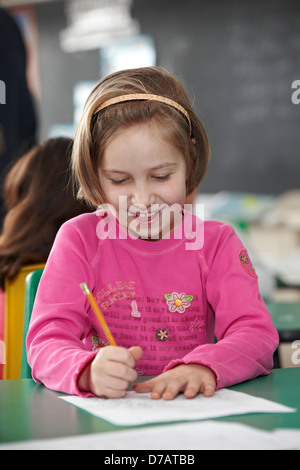 Young Grade 2 Student Working At Her Desk; Toronto Ontario Canada Stock Photo