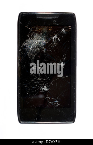 Black smartphone with a shattered screen isolated on white. Stock Photo