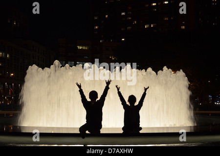 Children's silhouette at the Lincoln Center Fountain Stock Photo