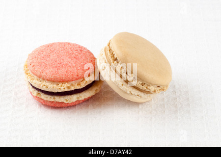 Blackcurrant-violet, and London Fog (vanilla and Earl Grey) macarons Stock Photo