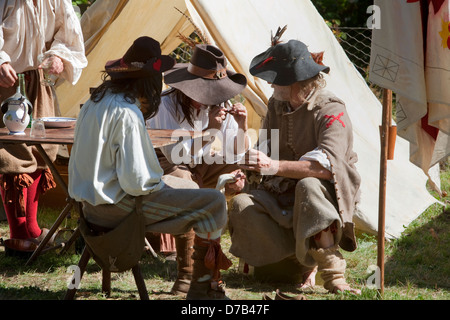 Men dressed in Medieval costumes sitting in front of a tent, live role-play, Musée d'Art Moderne Grand-Duc Jean, Luxembourg City Stock Photo