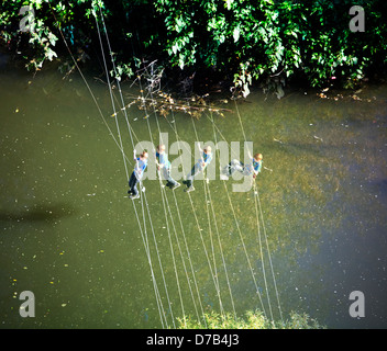 A boy is climbing over river Alzette, Luxembourg, Europe, digital managed Stock Photo