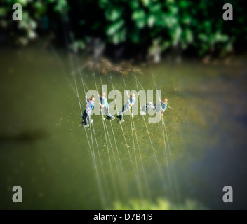 A boy is climbing over river Alzette, Luxembourg, Europe, digital managed Stock Photo