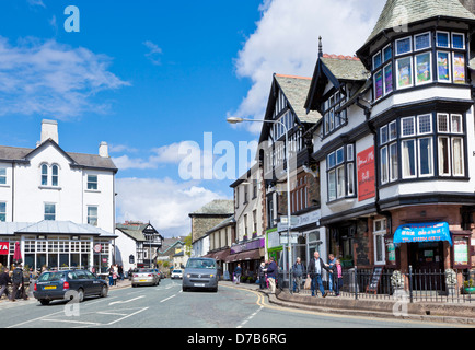 Cars driving through the centre of Bowness on windermere Cumbria Lake District England UK GB EU Europe Stock Photo