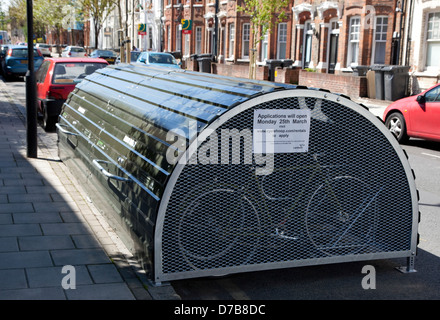 Secure lockable bicycle storage facility in residential street in Stockwell, South London Stock Photo