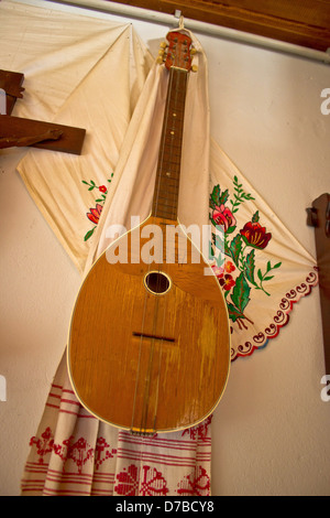 Tamburica (tambourica)- Croatian traditional music instrument on the wall Stock Photo