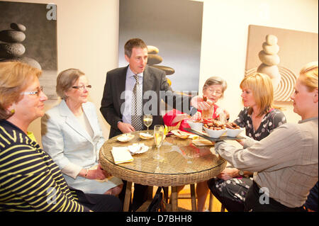 Llandrindod Wells, UK. 3rd May 2013. A waitress serves canapes in the new Spa Extension. Owners, Justin Baird-Murray and his sister Sarah Hill have overseen a £5 million refurbishement of The Metropole Hotel, resulting in an upgrade to its current four-star status. A six figure sum was secured to carry out the new spa development supported by Barclays. Edwina Hart, Minister for Economy, Sciences & Transport said, “The tourism sector is one of our key growth markets and is worth £5 billion to the Welsh economy.” Photo Credit: Graham M. Lawrence/Alamy Live News. Stock Photo