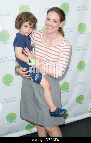 Erica Hill and son Weston Robert Yount Baby Buggy Bedtime Bash held at Wollman Rink in Central Park - Inside Arrivals New York Stock Photo