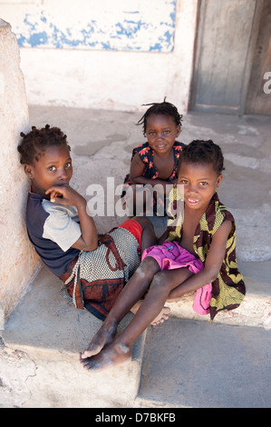 Children sitting in the street, Ibo island, Mozambique Stock Photo