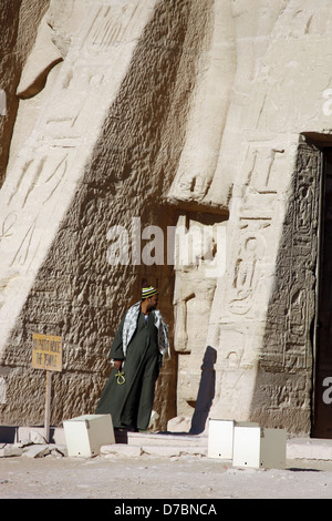 EGYPTIAN MAN AT TEMPLE ENTRANCE ABU SIMBEL NUBIA EGYPT 11 January 2013 Stock Photo