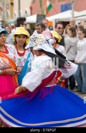 Girls dancing in traditional Peruvian dresses during a Multi-cultural event, international fair in Fuengirola, Spain. Stock Photo