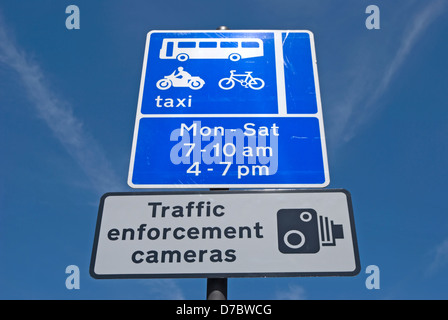 british road signs indicating traffic enforcement cameras and taxi, cycle and bus lane restrictions Stock Photo