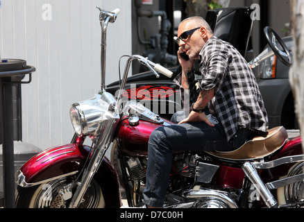Christian Audigier drives a vintage Harley Davidson on his way to visit a new building in Culver City where the Fashion designer is planning to build a one of a kind garage featuring his amazing collection of motorcycles and cars Los Angeles, California – 23.05.11 TM@Bleuazurcorp.com C Stock Photo