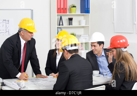 architect giving presentation to a small business group. Stock Photo