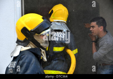 Rio Maior , Portugal. 3rd May 2013. . Firemans try to save the house structure extinguish the fire inside. Credit:  Bruno Monico / Alamy Live News Stock Photo
