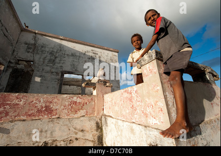 Children playing on old colonial building, Ilha do Mocambique, Mozambique Stock Photo