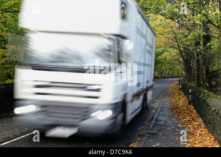 Motion blurred van on a local country road in Autumn, Scotland, UK Stock Photo