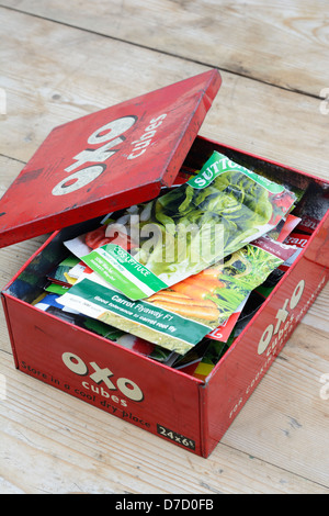 Old 'OXO' tin containing seed packets Stock Photo