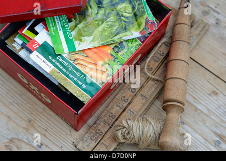 Old 'OXO' tin containing seed packets Stock Photo