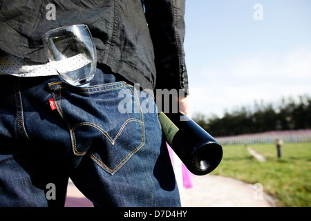 A man and the empty glass back to the camera Stock Photo