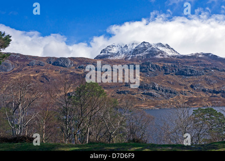 Changing April weather over Loch Maree in in Wester Ross Highland Scotland with mountain Slioch Stock Photo