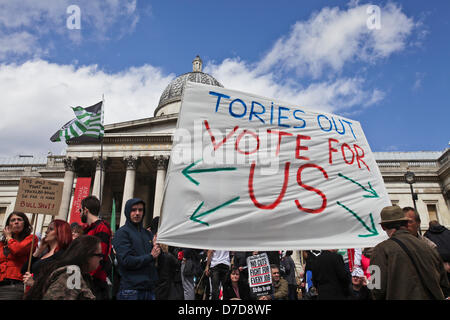 London, UK. 4th May 2013. Protesters, many from the internet hacker collective 'Anonymous', gather in Trafalgar Square to rally against public spending cuts and the 'bedroom tax'. Credit:  Rob Pinney / Alamy Live News Stock Photo
