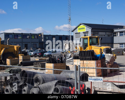 Construction site with houses, machinery cars and building equipment belonging to the firm Skanska, in Oslo Norway Stock Photo