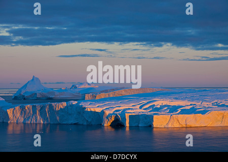 Icebergs at sunrise in the Kangia icefjord, Disko-Bay, West-Greenland, Greenland Stock Photo