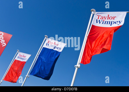 Taylor Wimpey flags flying at a housing development in King's Lynn, Norfolk. Stock Photo