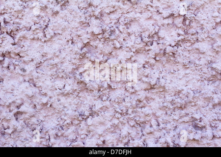A fragment of the wall of the house, covered with original stucco and painted. Stock Photo