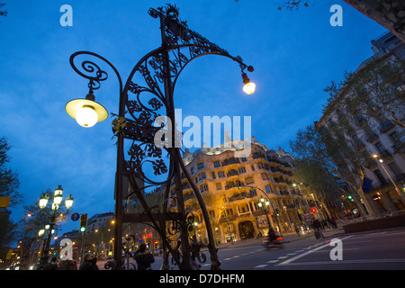 Lampost on Passeig de Gracia in front of Gaudi's La Pedrera - Barcelona, Spain. Stock Photo
