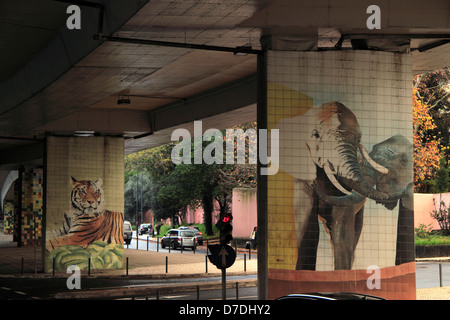 Animal mural on a wall under, a flyover, advertising Lisbon zoo, Portugal Stock Photo