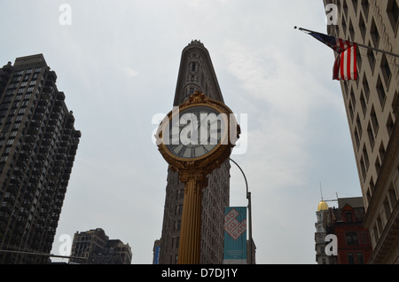 Clock and the Flatiron Building in New York City