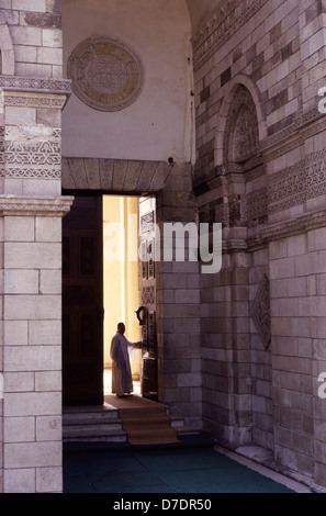 The monumental entrance with its projecting stone porch of Al Hakim mosque nicknamed al-Anwar named after Al-Hakim bi-Amr Allah (985–1021), the sixth Fatimid caliph and 16th Ismaili Imam located in Islamic Cairo Egypt Stock Photo