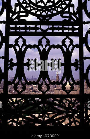 View of Cairo cityscape through cast Iron railings of Saladin or Salaḥ ad-Dīn Citadel a medieval Islamic fortification located on Mokattam hill in Cairo, Egypt Stock Photo