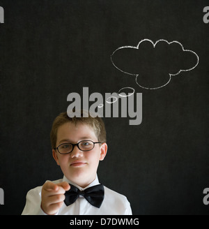 Education needs you thinking boy dressed up as business man with thought thinking chalk cloud on blackboard background Stock Photo