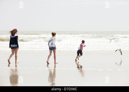 Family of 3 playing at beach