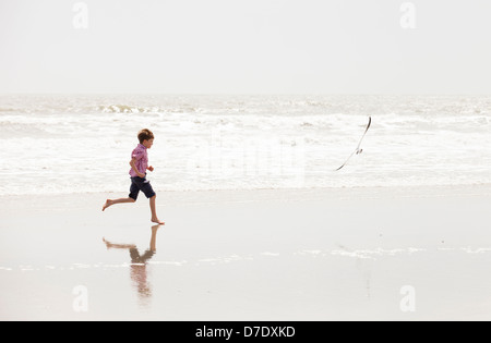 boy running on beach