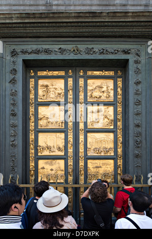 Tourists in front of Golden Door of the Florence Baptistery (Battistero di San Giovanni), Italy Stock Photo
