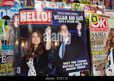 Prince 'William and Kate have a wizard time' headline  on the cover of Hello Magazine on W.H. Smith newspaper newsstand news shelf London England UK Stock Photo