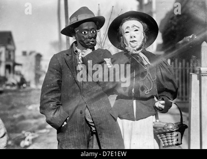 Thanksgiving Maskers - An old Thanksgiving tradition where children would dress up as hobos and go around begging for change, circa 1910 Stock Photo